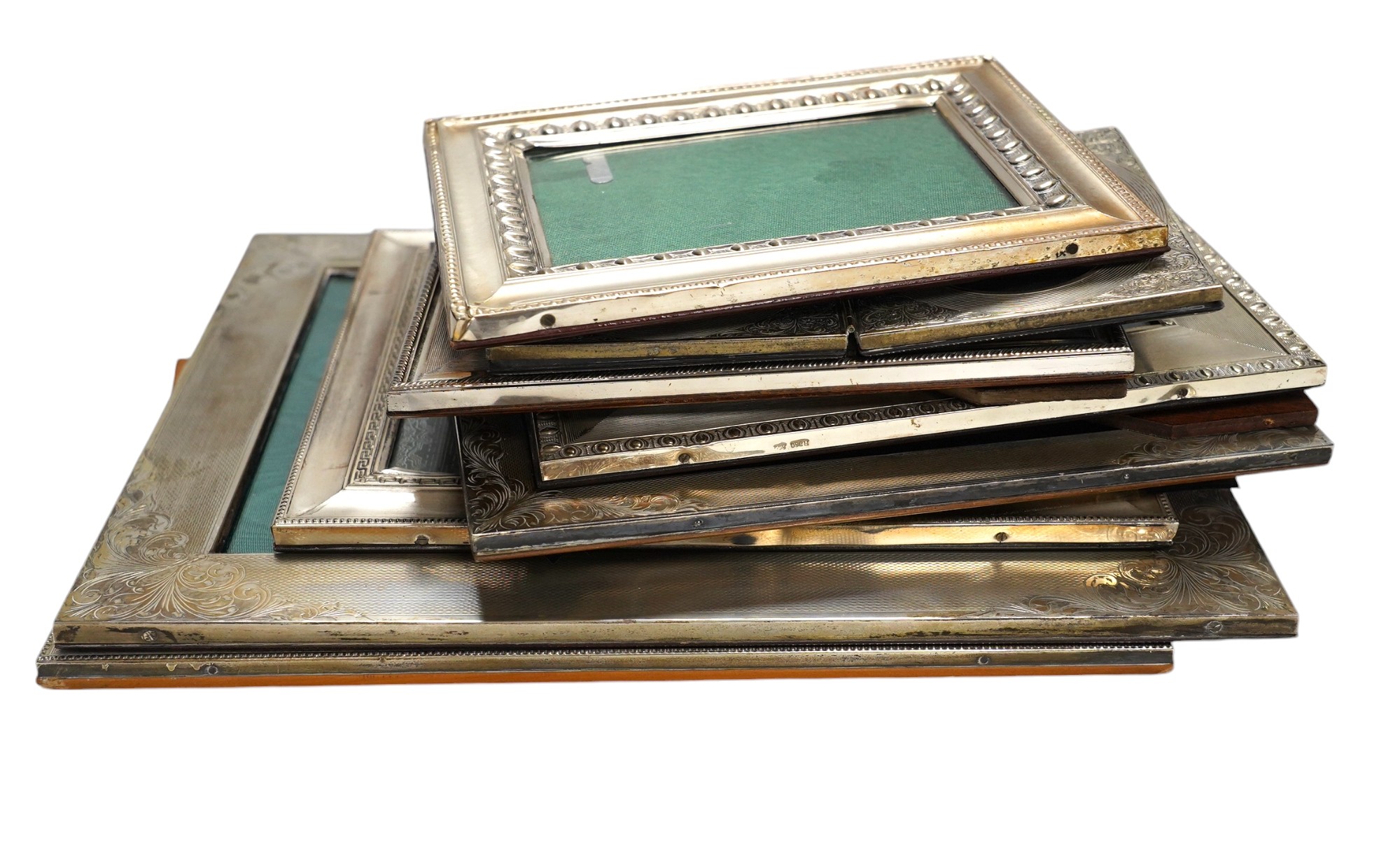 Nine assorted late 20th century 800 standard white metal mounted photograph frames, mainly Italian, including a double frame, largest 29.6cm. Condition - poor to fair